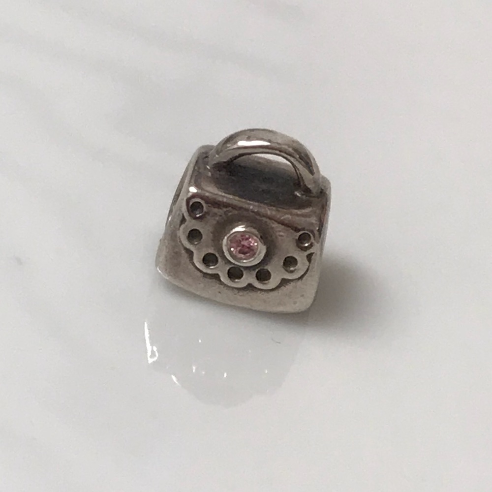 Pandora purse with pink jewel charm